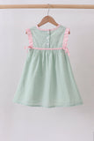 Green swiss dot cross sheep ruffle dress - Aaria Tees Aaria Tees