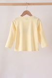 Beige character embroidery top Aaria Tees
