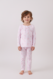 Child wearing pink floral pajamas on a white background Aaria Tees