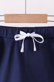 Navy scallop hem bow skort Aaria Tees