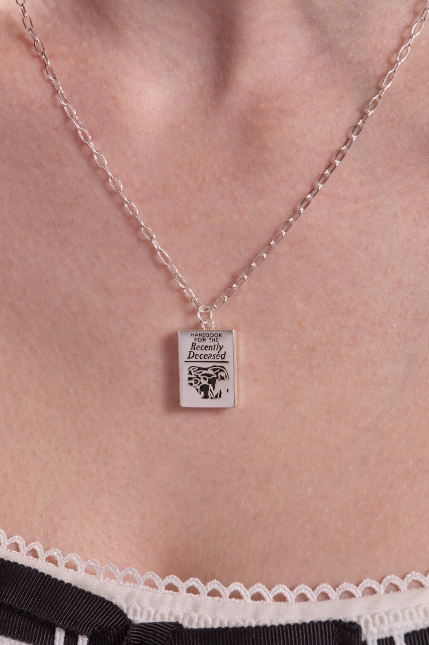 BEETLEJUICE™ 'Handbook for the Recently Deceased' Pendant Necklace - Aaria Tees Aaria Tees