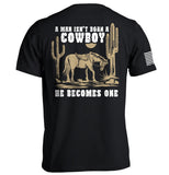 A Man Isn't Born A Cowboy Aaria Tees