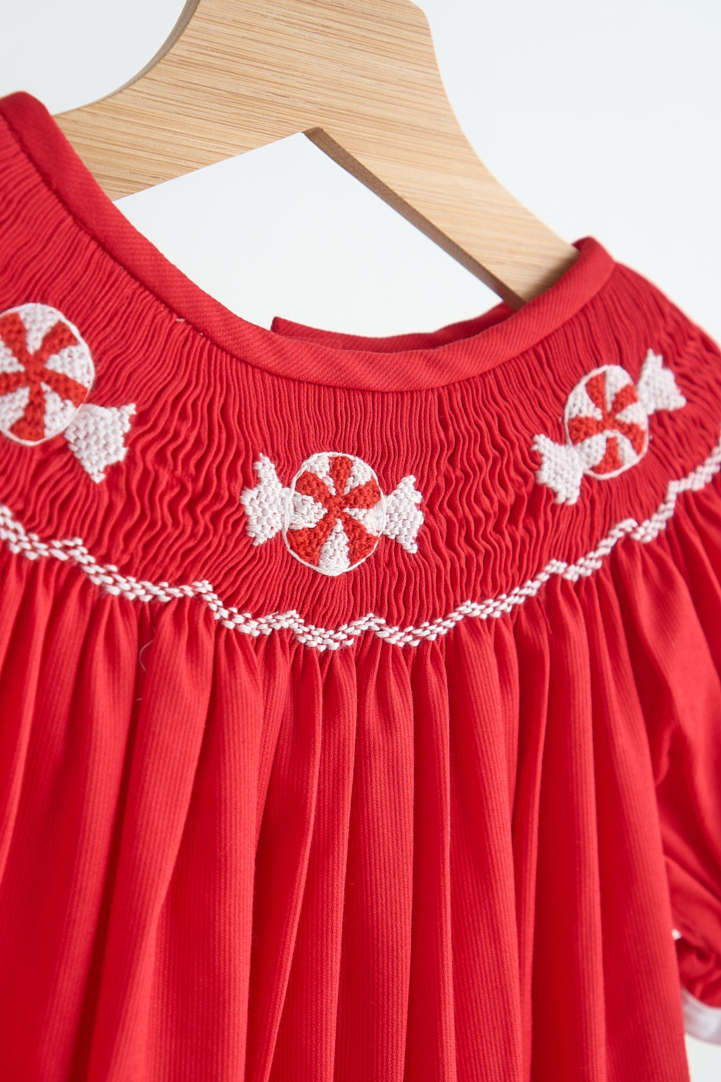 Red candy hand smocked girl romper - Aaria Tees Aaria Tees