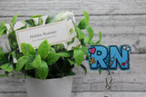 RN Blue Badge Reel Aaria Tees