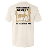 A Man Isn't Born A Cowboy Aaria Tees