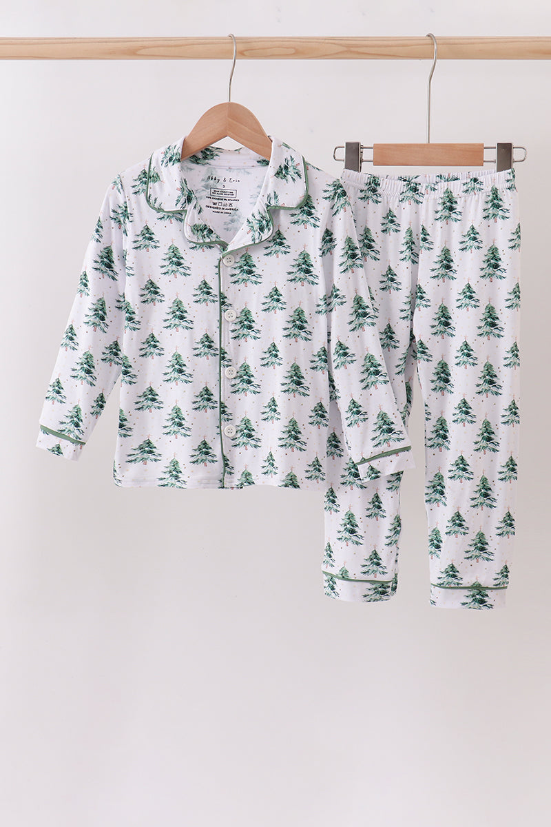 Children's pajama set with tree pattern on hangers against a white background Aaria Tees