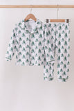 Children's pajama set with tree pattern on hangers against a white background Aaria Tees