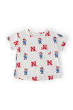 Nebraska White Herbie Husker Ruffle Pocket Tee - Aaria Tees Aaria Tees