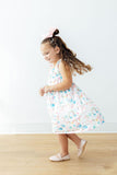 Unicorn Kisses Ruffle Cross Back Dress - Aaria Tees Aaria Tees