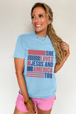 Light Blue SHE LOVES JESUS AND AMERICA TOO Flag Graphic T Shirt - Aaria Tees Aaria Tees