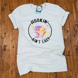 Hookin' Ain't Easy - Heather Prism Natural Tee - Aaria Tees Aaria Tees