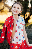Nebraska White Herbie Husker Ruffle Pocket Tee - Aaria Tees Aaria Tees