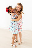 Fancy Flags Ruffle Cross Back Dress - Aaria Tees Aaria Tees